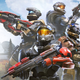 A group of Spartans from the Halo series stand back-to-back.